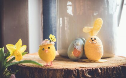 Easter chick, rabbit and decorated eggs on a table